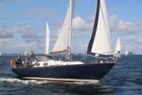 Traditional cruising boat with halyards at the mast