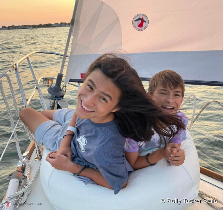 family sailing in summer